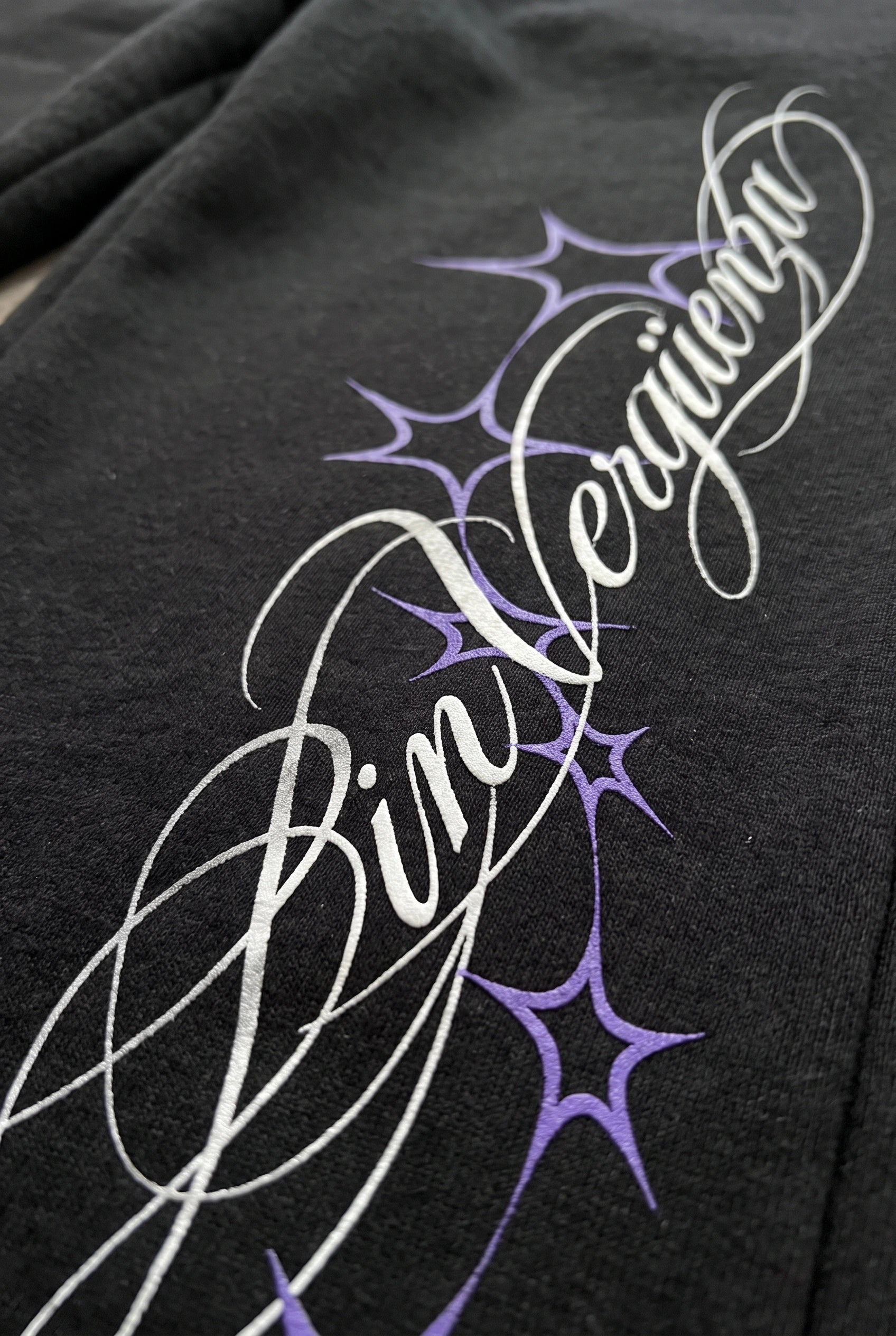 Bon Appetit front leg artwork detail on black sweatpants